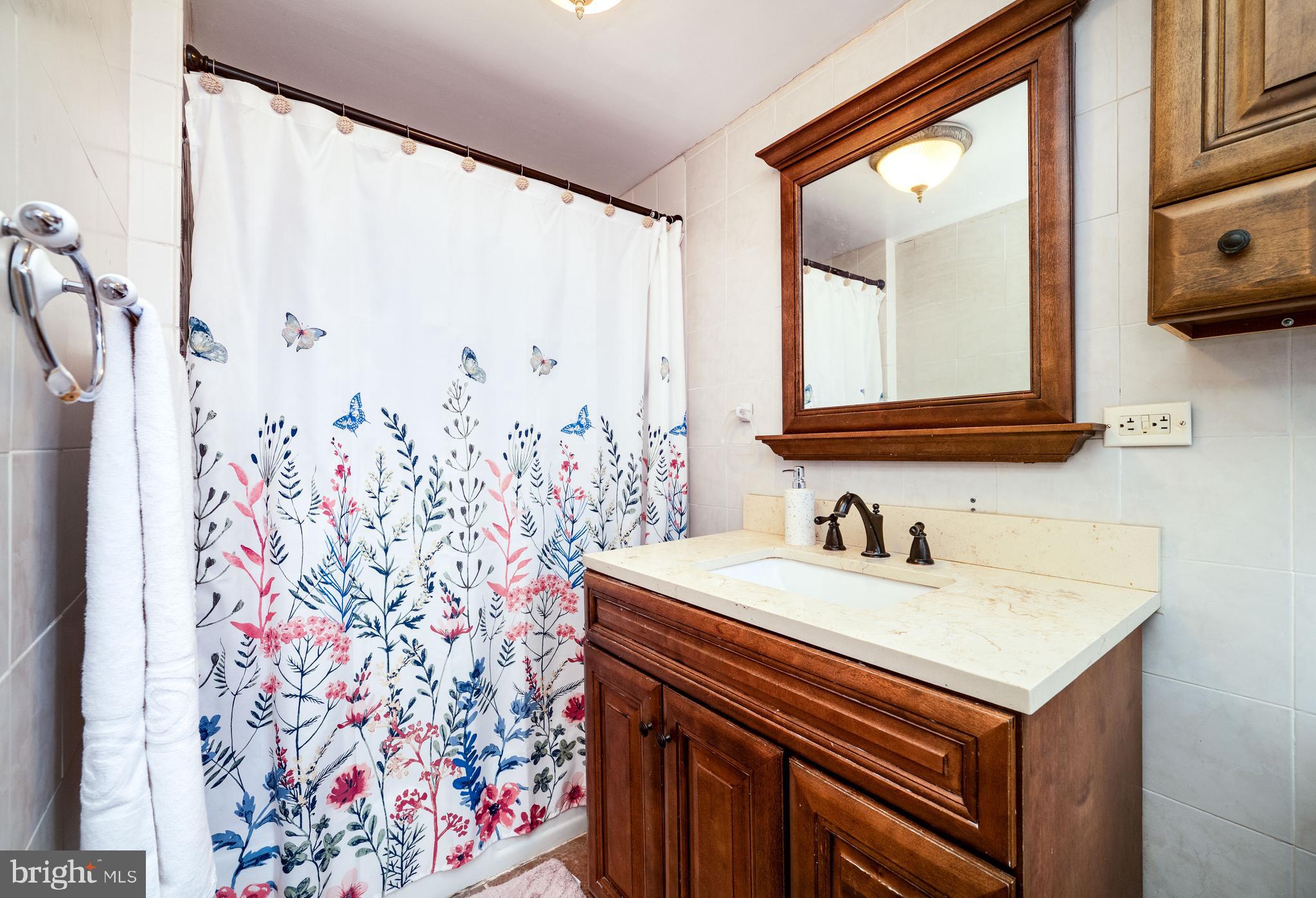 1108 Liberty Avenue Reading, PA 19607 - Photo 13 of 24 a bathroom with a sink and a mirror