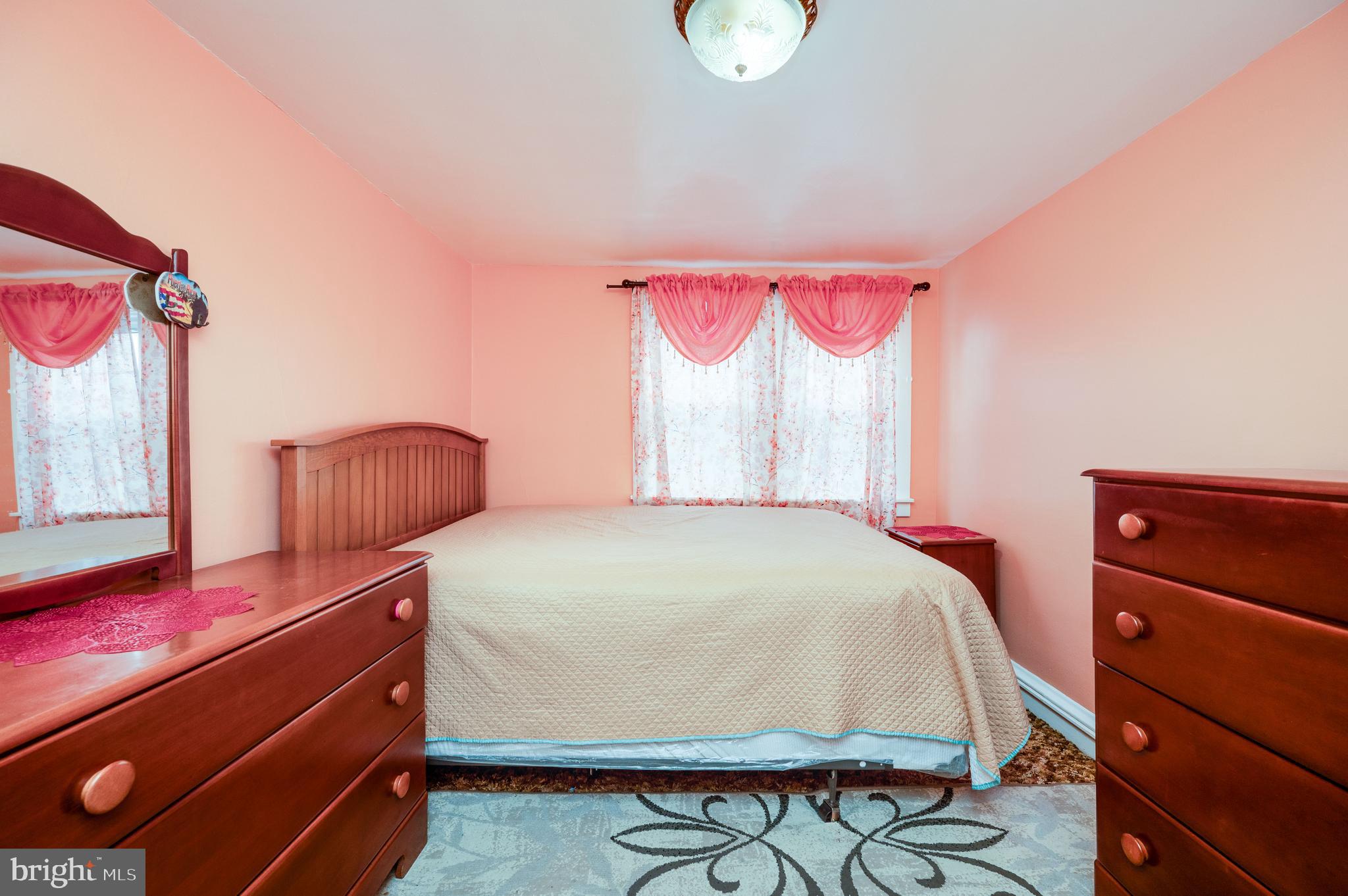 1108 Liberty Avenue Reading, PA 19607 - Photo 14 of 24 a bedroom with a bed and a dresser with wooden floor