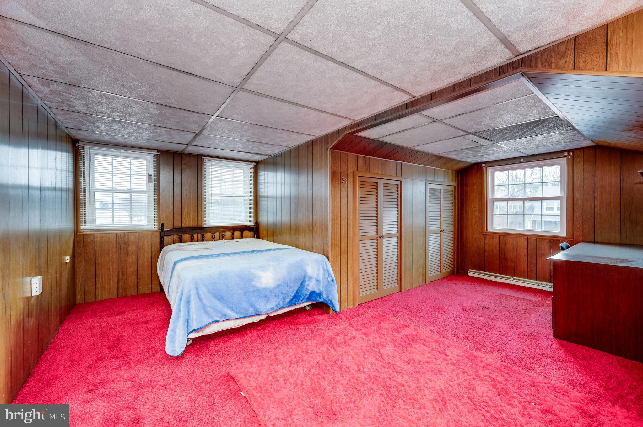 1108 Liberty Avenue Reading, PA 19607 - Photo 15 of 24 a bedroom with a bed and large windows