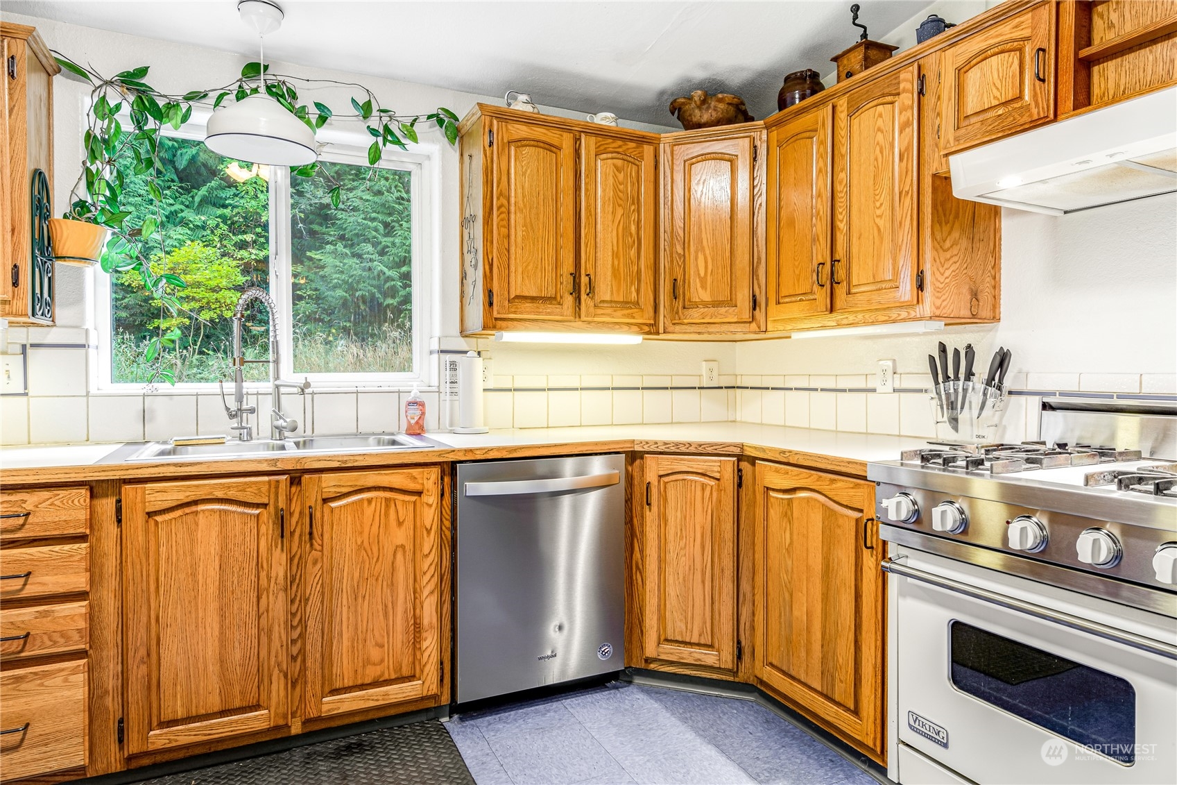 142 Ash Loop Port Townsend, WA 98368 - Photo 14 of 29 a kitchen with stainless steel appliances granite countertop a sink and a microwave