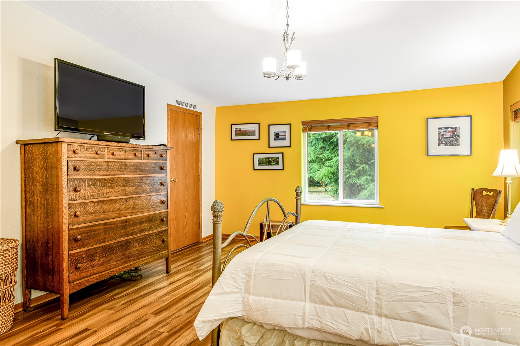 142 Ash Loop Port Townsend, WA 98368 - Photo 16 of 29 a bedroom with a bed and flat screen tv