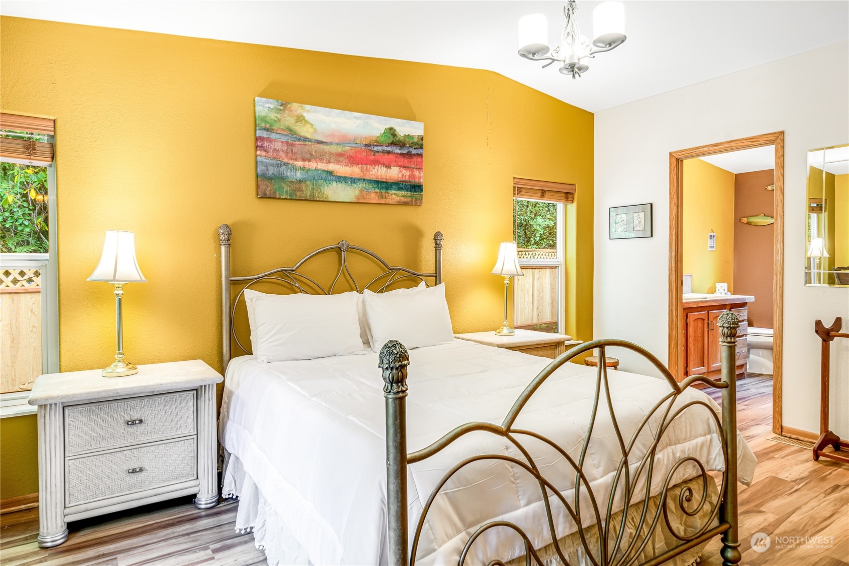 142 Ash Loop Port Townsend, WA 98368 - Photo 17 of 29 a bed room with a bed and a painting on the wall