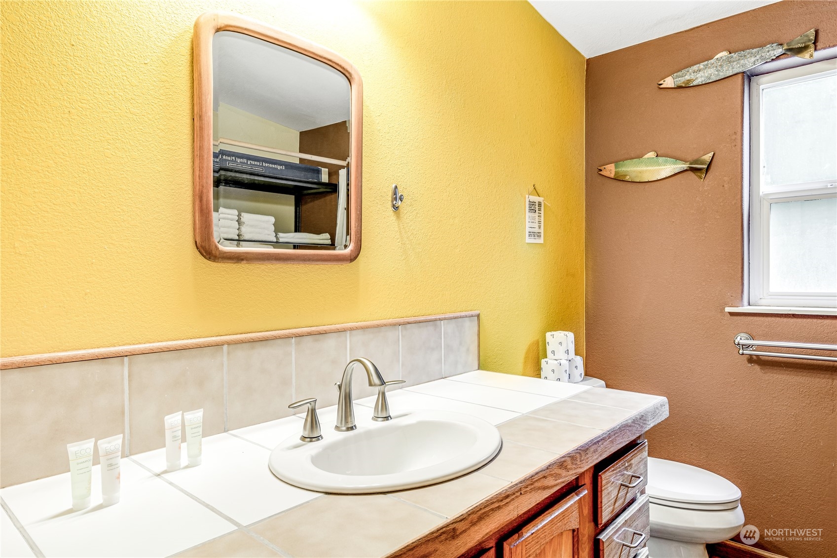 142 Ash Loop Port Townsend, WA 98368 - Photo 19 of 29 a bathroom with a sink toilet and mirror