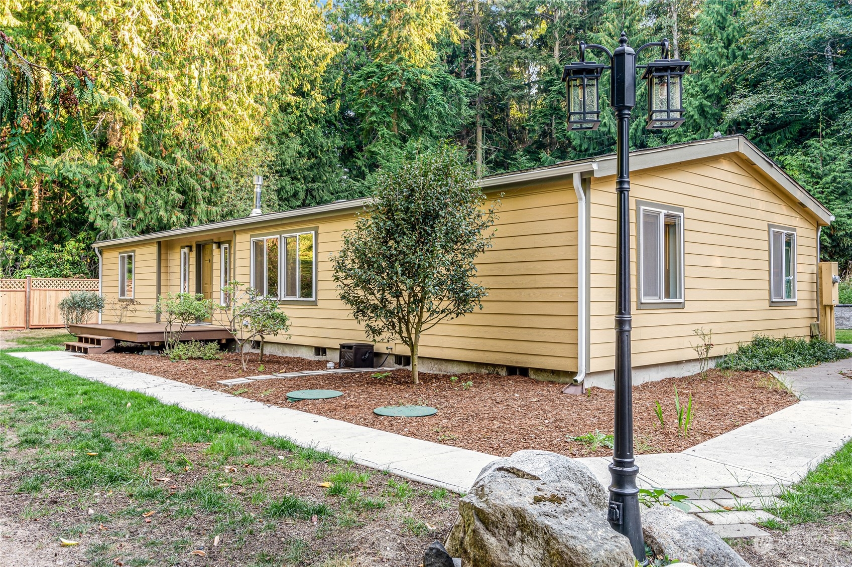142 Ash Loop Port Townsend, WA 98368 - Photo 2 of 29 a backyard of a house with seating space