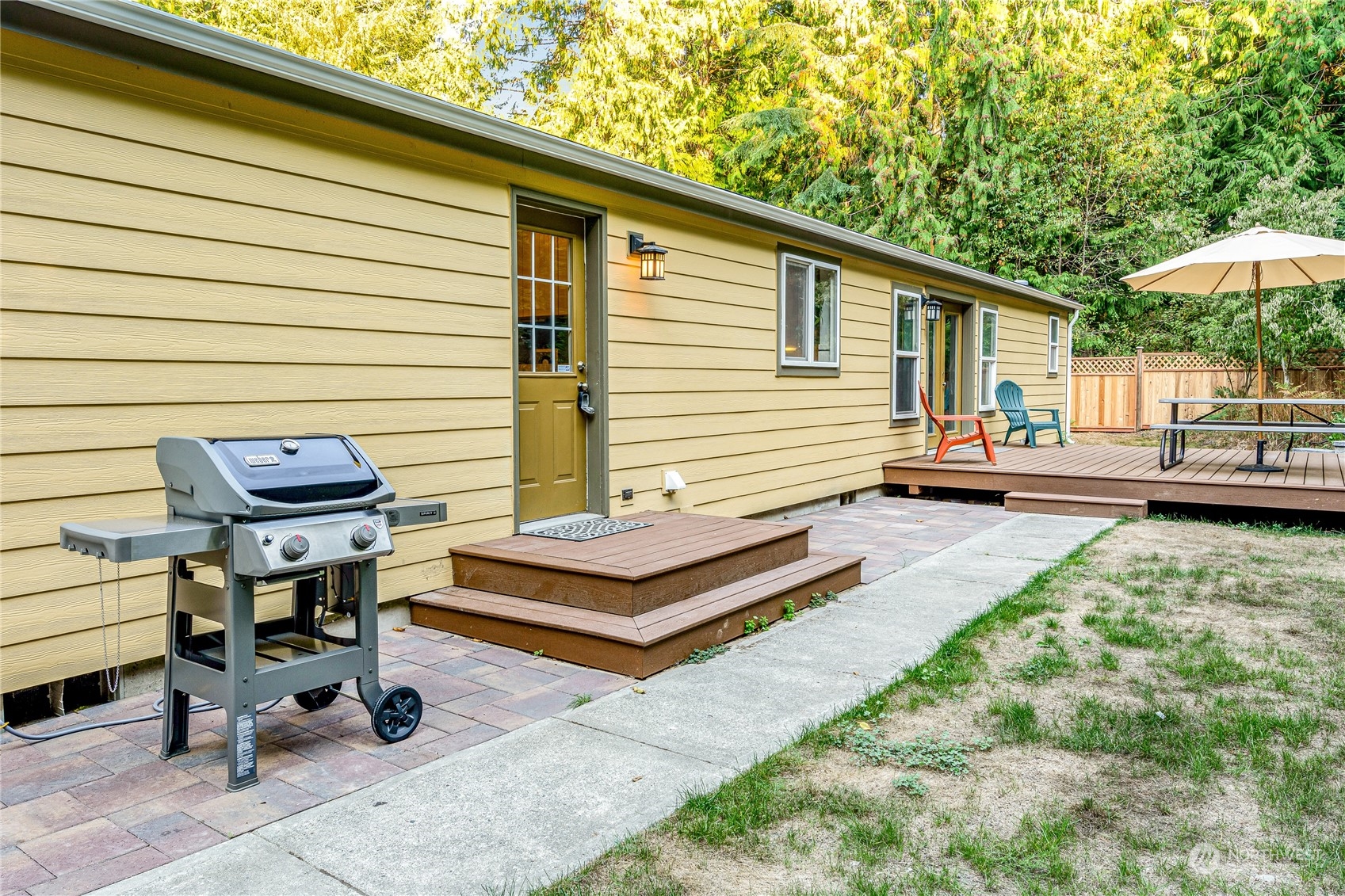 142 Ash Loop Port Townsend, WA 98368 - Photo 27 of 29 a backyard of a house with barbeque oven table and chairs