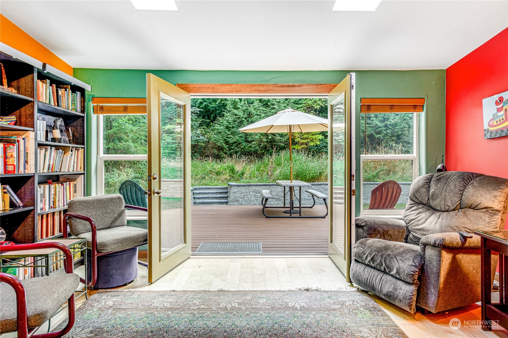 142 Ash Loop Port Townsend, WA 98368 - Photo 4 of 29 a living room with furniture a bookshelf and a large window
