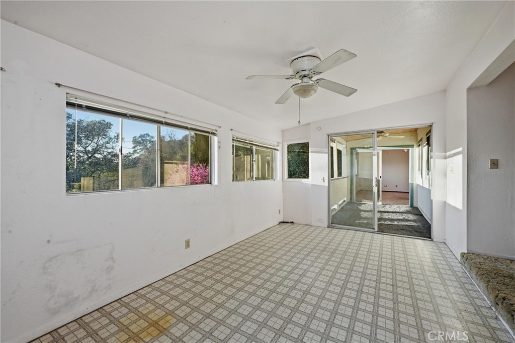 3398 Ogden Road Lucerne, CA 95458 - Photo 12 of 39 a view of empty room with wooden floor and fan