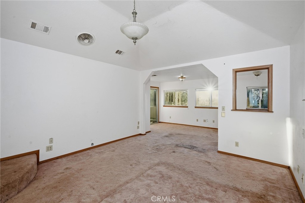 3398 Ogden Road Lucerne, CA 95458 - Photo 16 of 39 an empty room with a empty space and windows