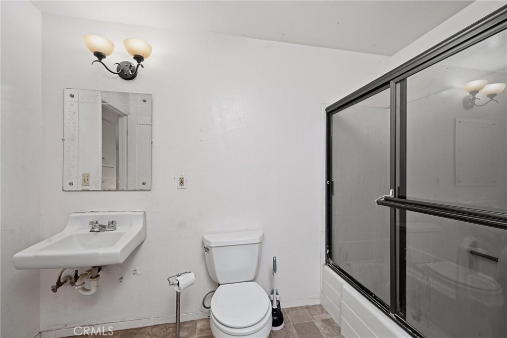 3398 Ogden Road Lucerne, CA 95458 - Photo 22 of 39 a bathroom with a sink toilet and vanity