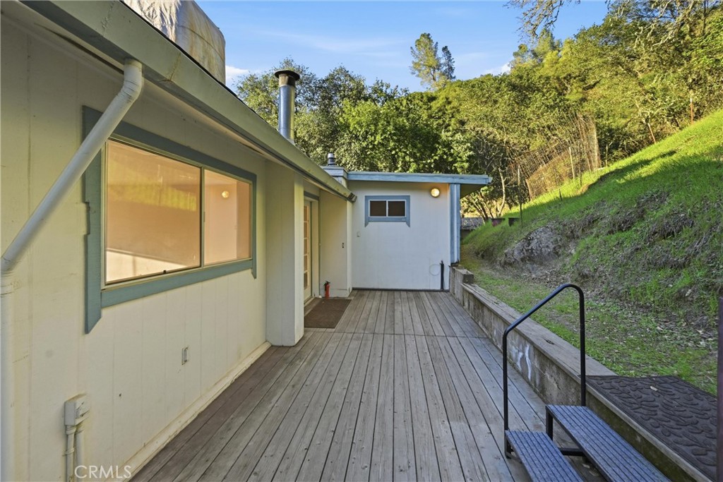 3398 Ogden Road Lucerne, CA 95458 - Photo 34 of 39 a view of backyard with a deck and wooden floor