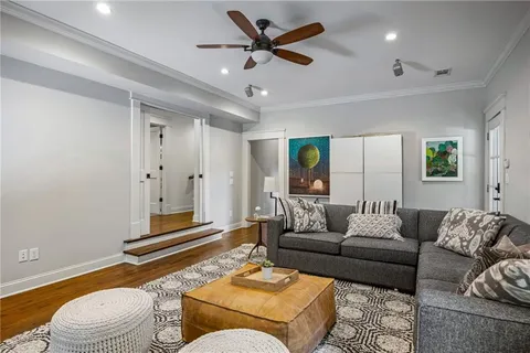 a living room with furniture and a rug