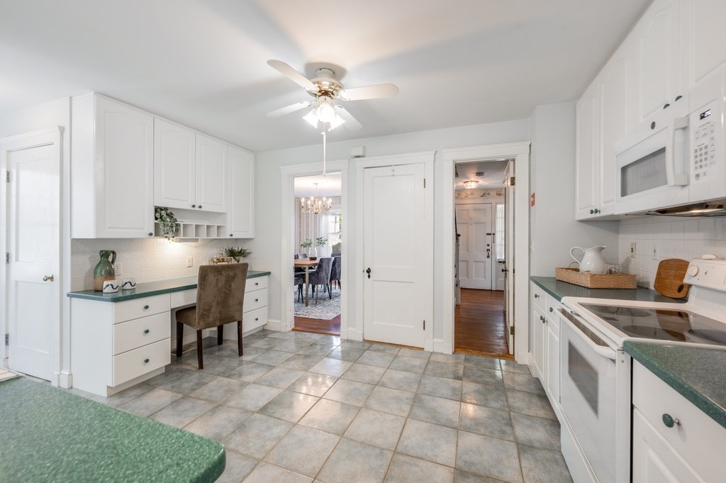 23 Pinewood Road Needham, MA 02492 - Photo 12 of 31 a kitchen with granite countertop a sink appliances cabinets and furniture