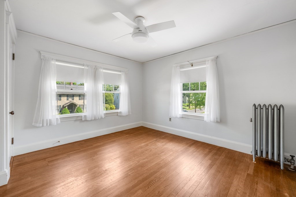 23 Pinewood Road Needham, MA 02492 - Photo 22 of 31 an empty room with wooden floor and windows