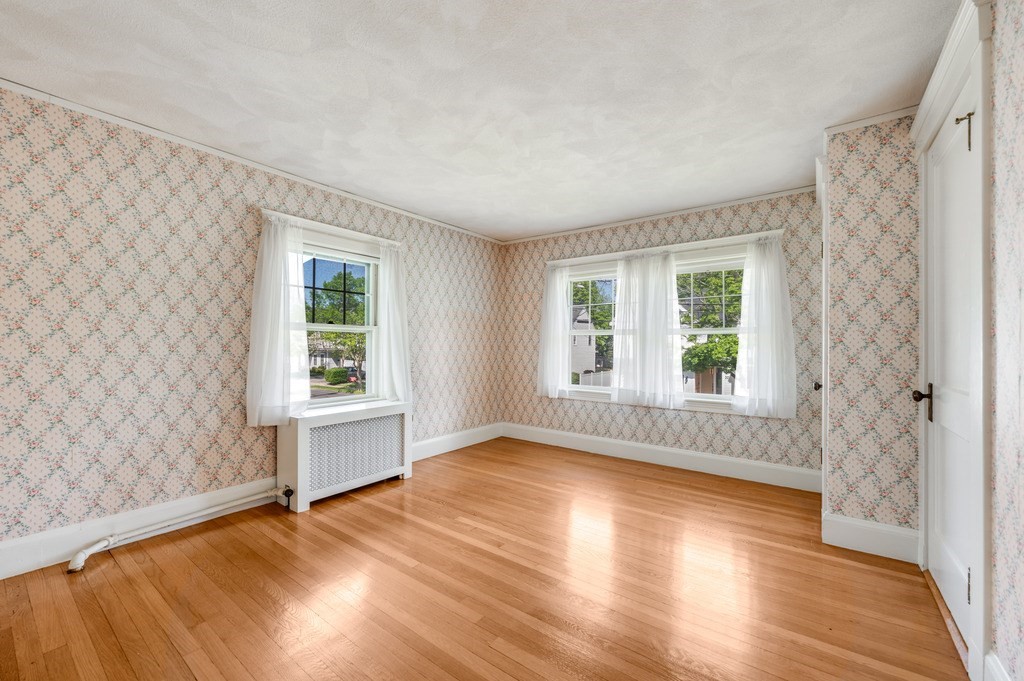 23 Pinewood Road Needham, MA 02492 - Photo 23 of 31 an empty room with wooden floor and windows