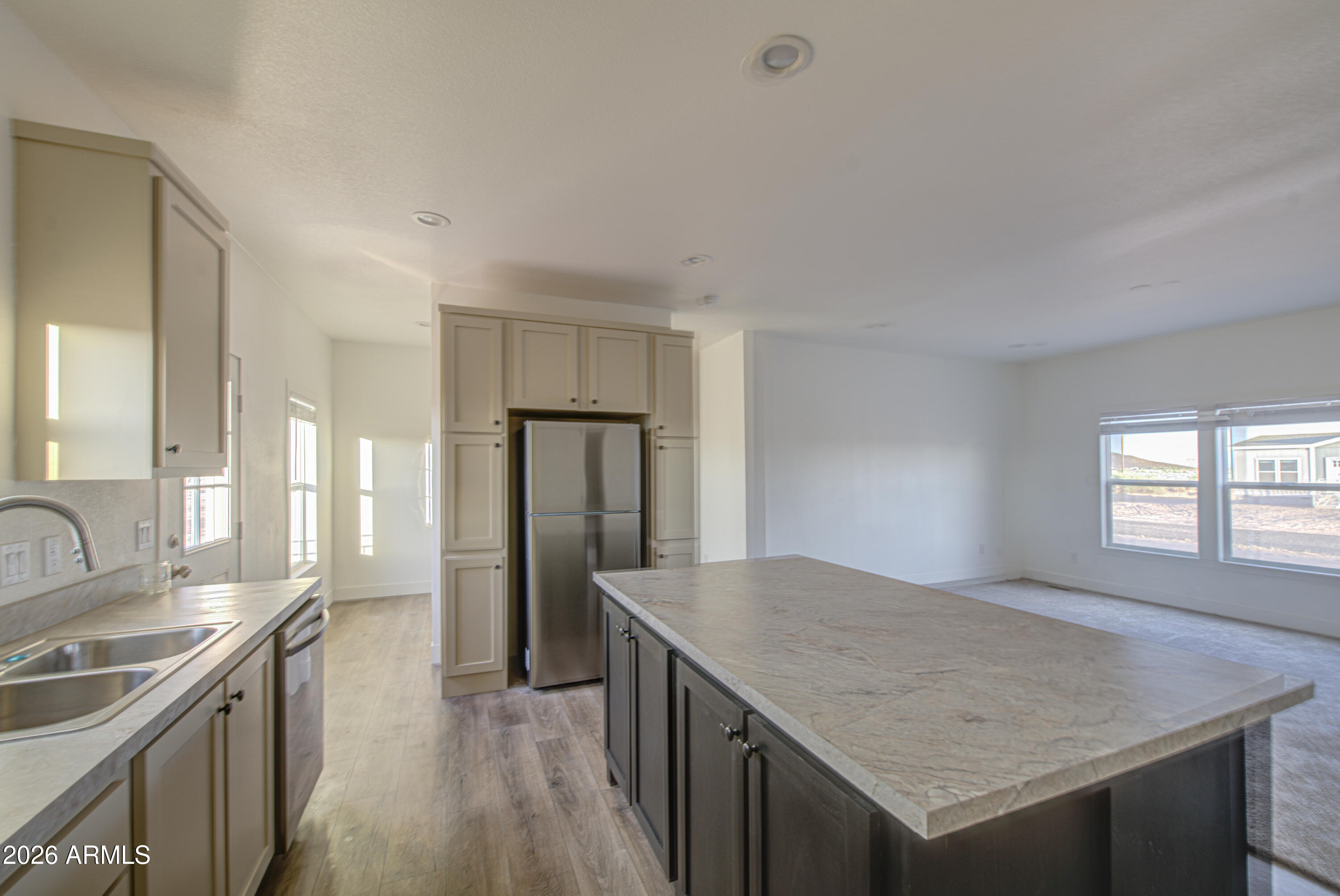 39112 West Maldonado Road Tonopah, AZ 85354 - Photo 13 of 34 a kitchen with a stove a refrigerator and a sink