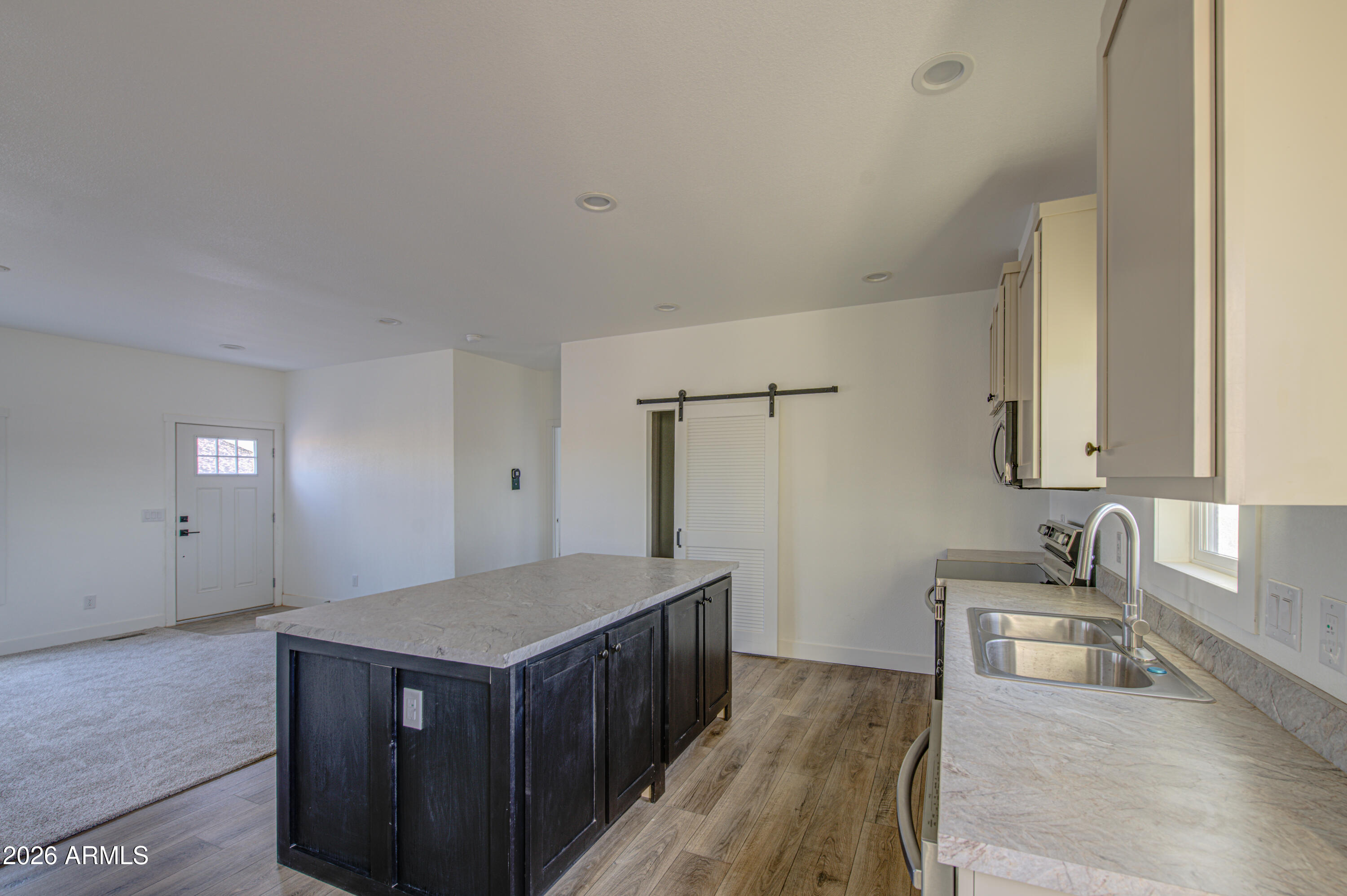 39112 West Maldonado Road Tonopah, AZ 85354 - Photo 14 of 34 a kitchen with a stove and a sink