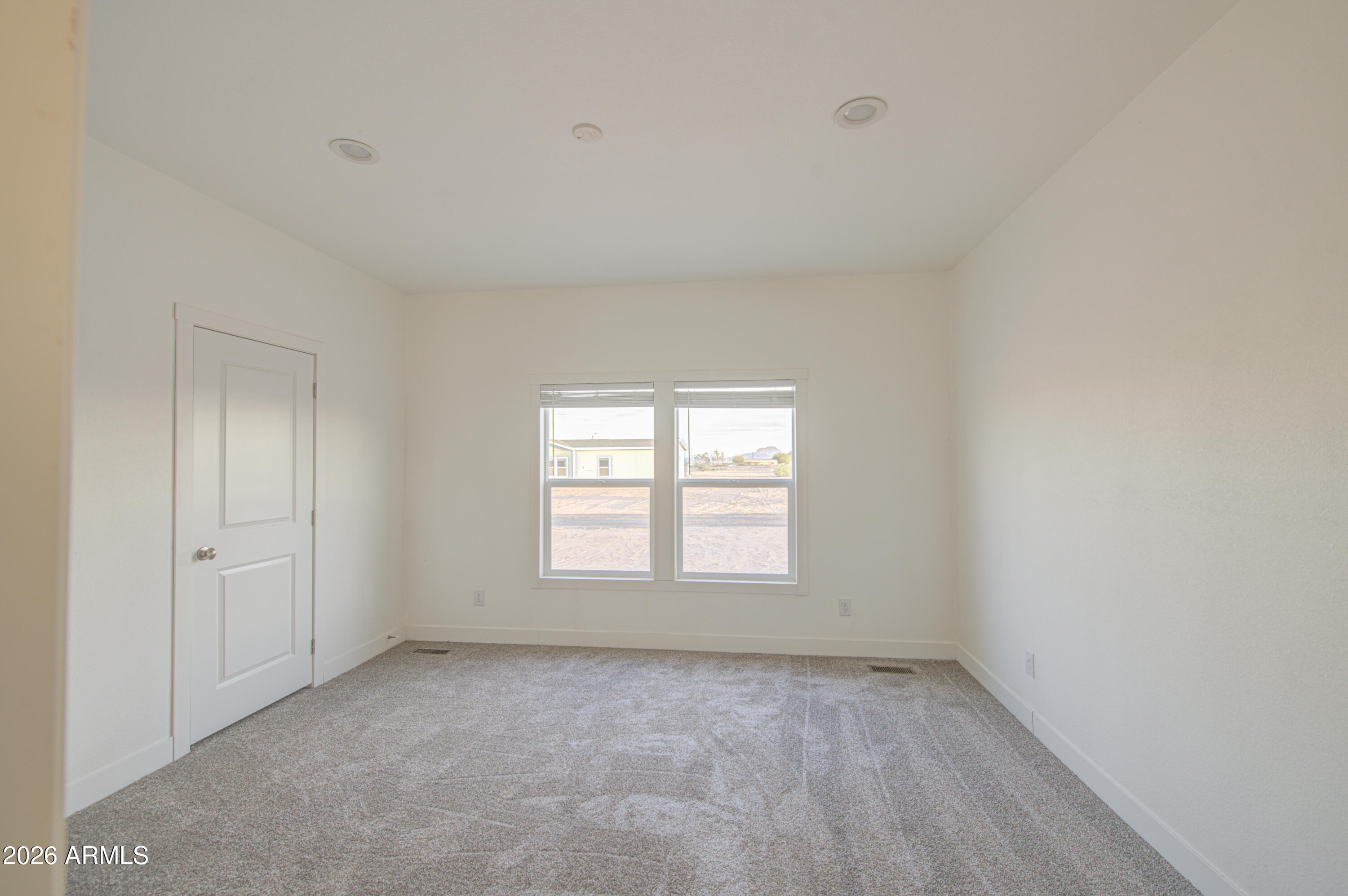 39112 West Maldonado Road Tonopah, AZ 85354 - Photo 18 of 34 an empty room with a window