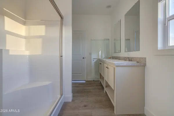 a bathroom with a sink a mirror and a bathtub