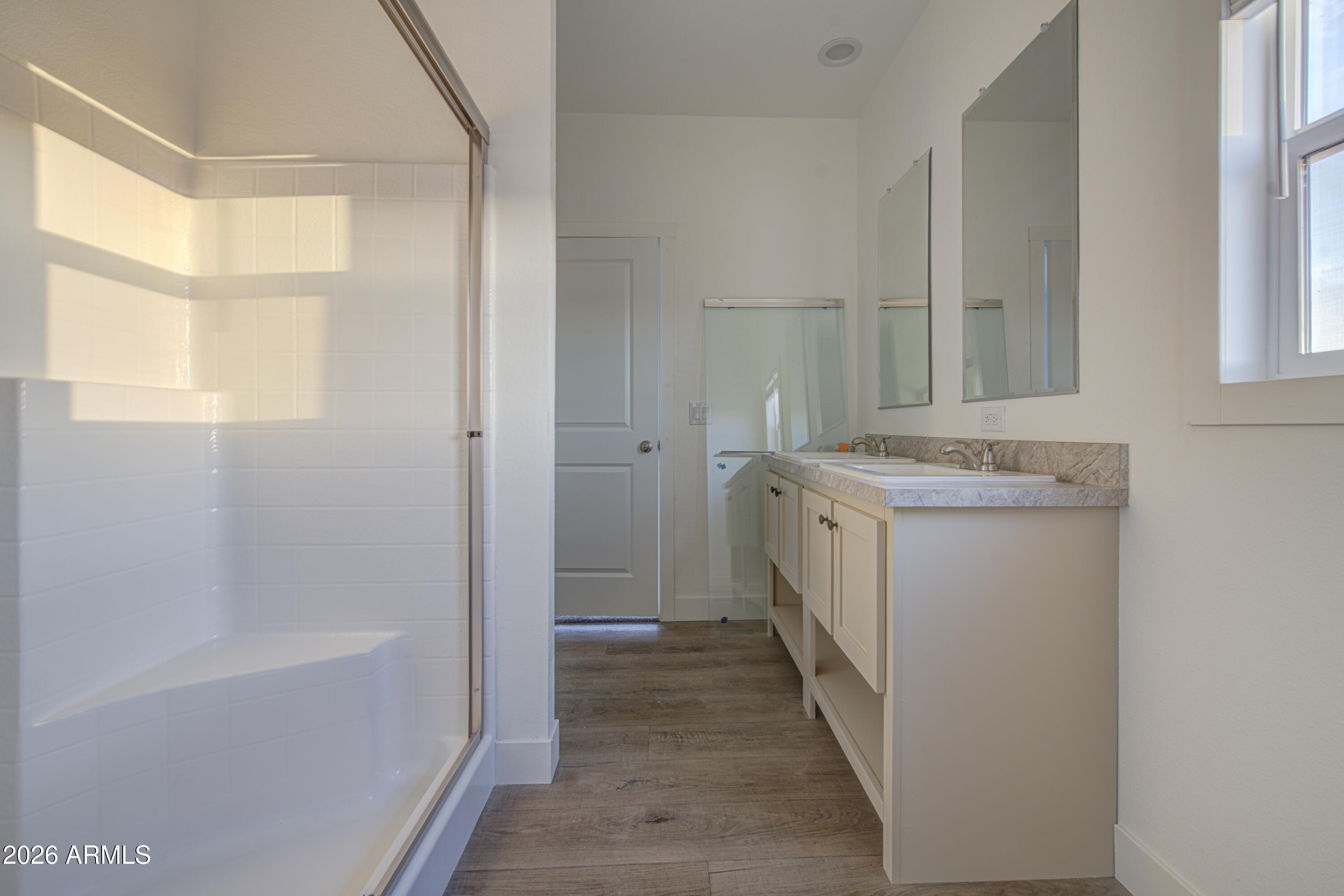 39112 West Maldonado Road Tonopah, AZ 85354 - Photo 20 of 34 a bathroom with a sink a mirror and a bathtub