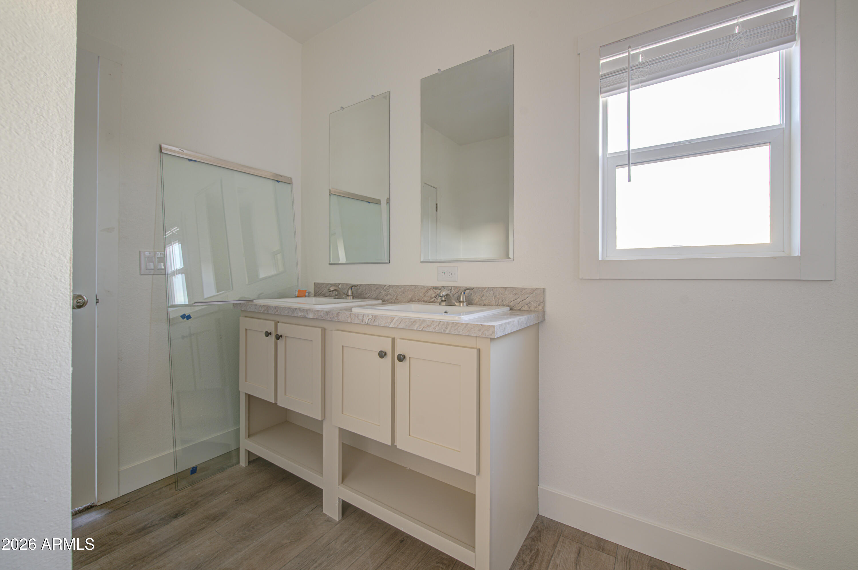 39112 West Maldonado Road Tonopah, AZ 85354 - Photo 21 of 34 a bathroom with a sink a vanity and a mirror