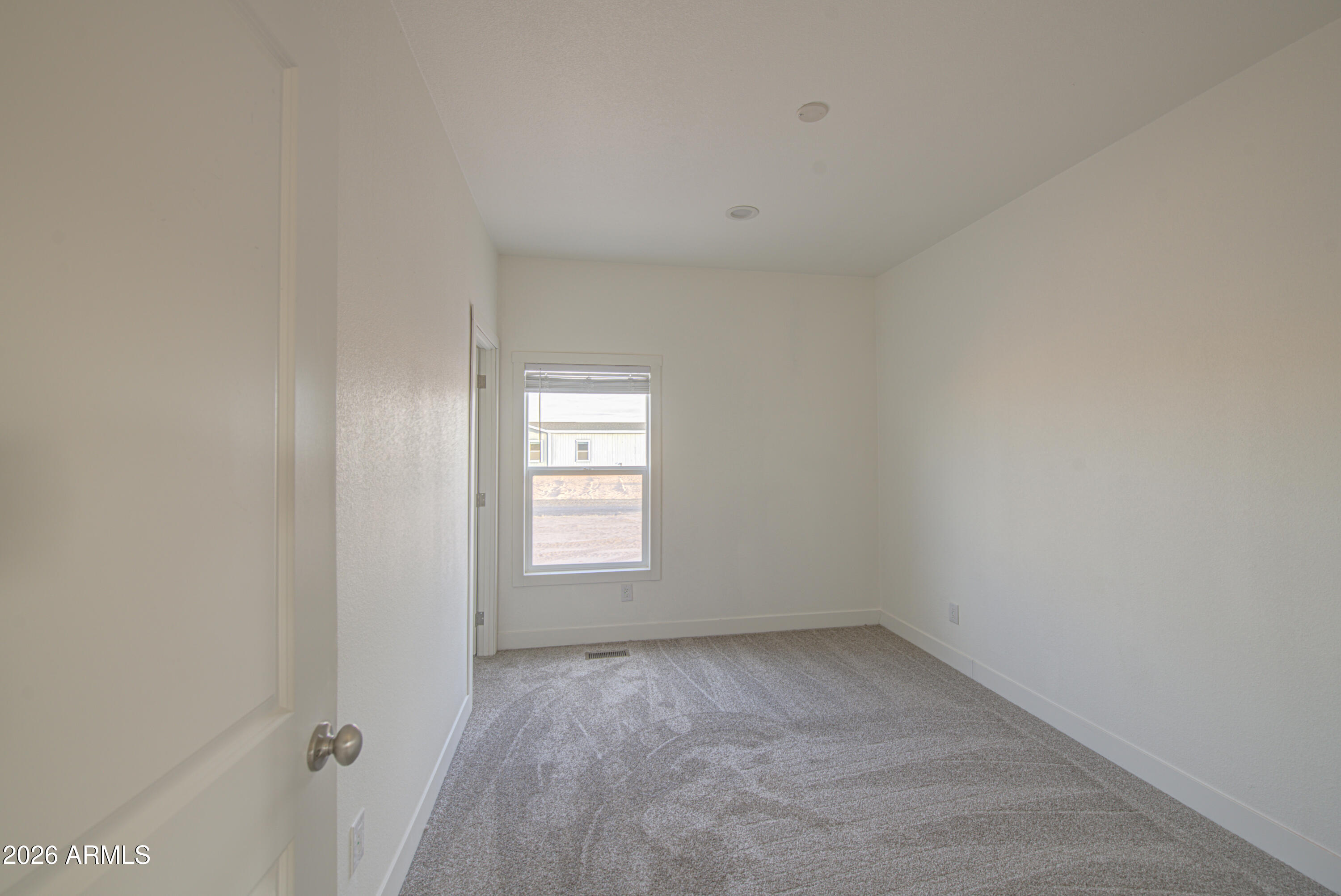 39112 West Maldonado Road Tonopah, AZ 85354 - Photo 22 of 34 a view of empty room with a window