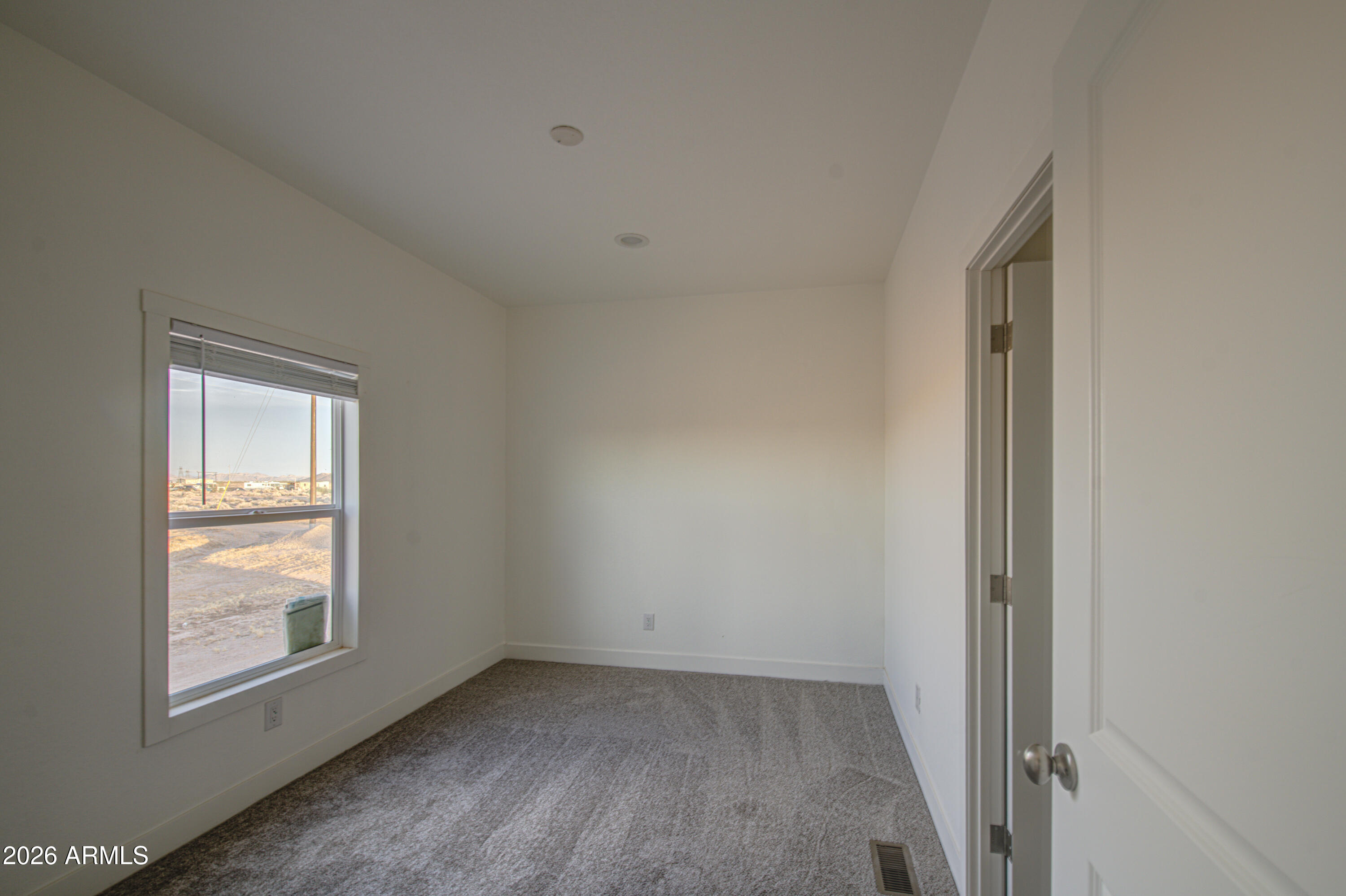 39112 West Maldonado Road Tonopah, AZ 85354 - Photo 26 of 34 an empty room with windows