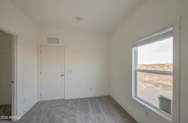 a view of an empty room and window