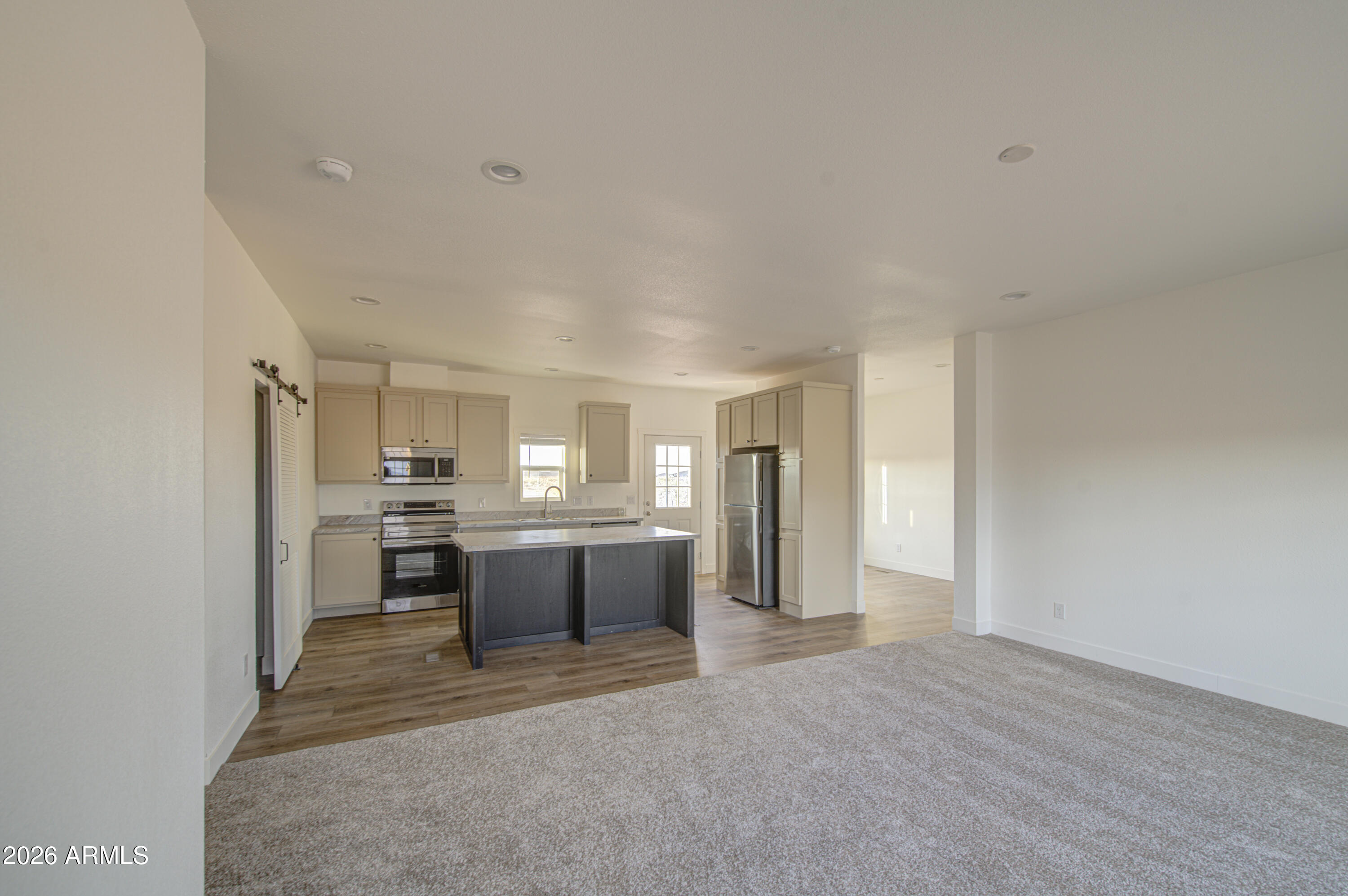 39112 West Maldonado Road Tonopah, AZ 85354 - Photo 5 of 34 a view of a kitchen with a sink and refrigerator