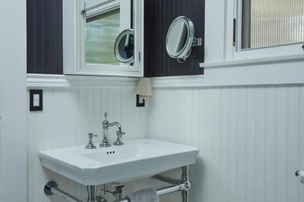 a bathroom with a sink and a mirror