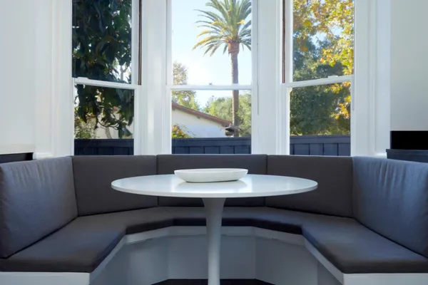 a dining room with furniture and window