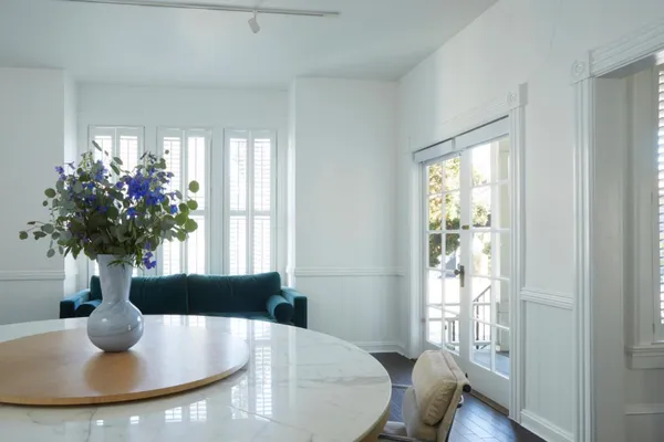 a view of a dining room with furniture window and wooden floor