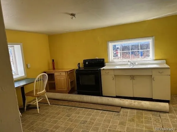 a kitchen with a sink and a window