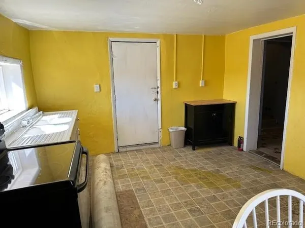 a living room with furniture and a closet