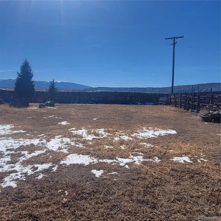 a view of a yard with a snow on the road