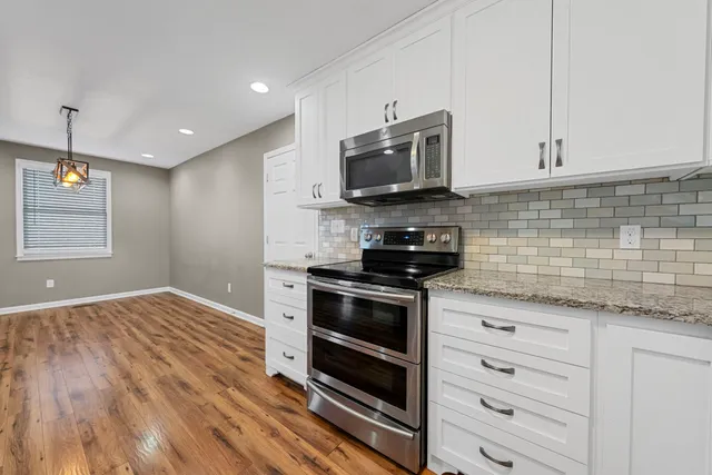 a bathroom with a sink a toilet and bathtub
