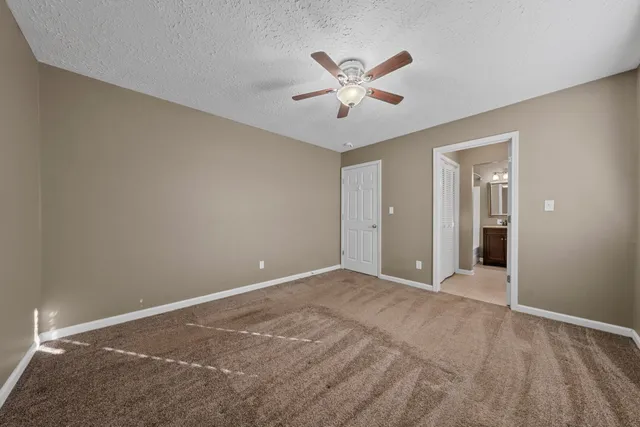 a view of fountain and a yard