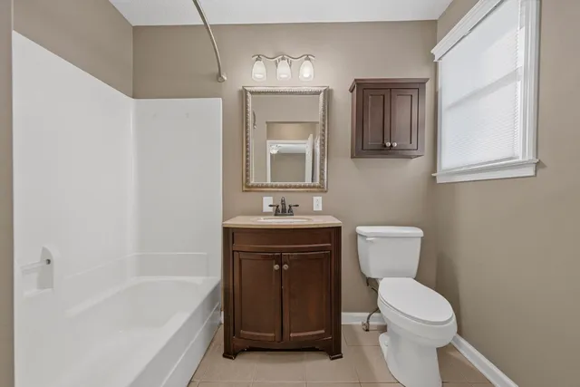 a view of a patio with table and chairs with wooden floor and fence