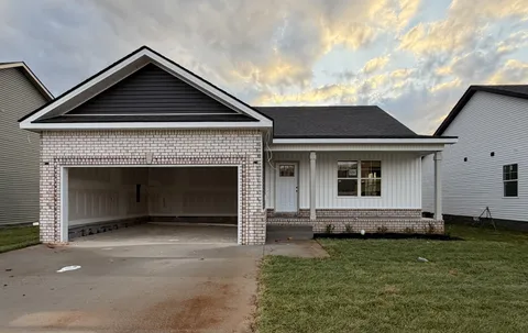 a front view of a house with yard