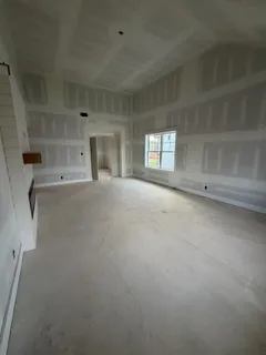 a view of empty room with windows