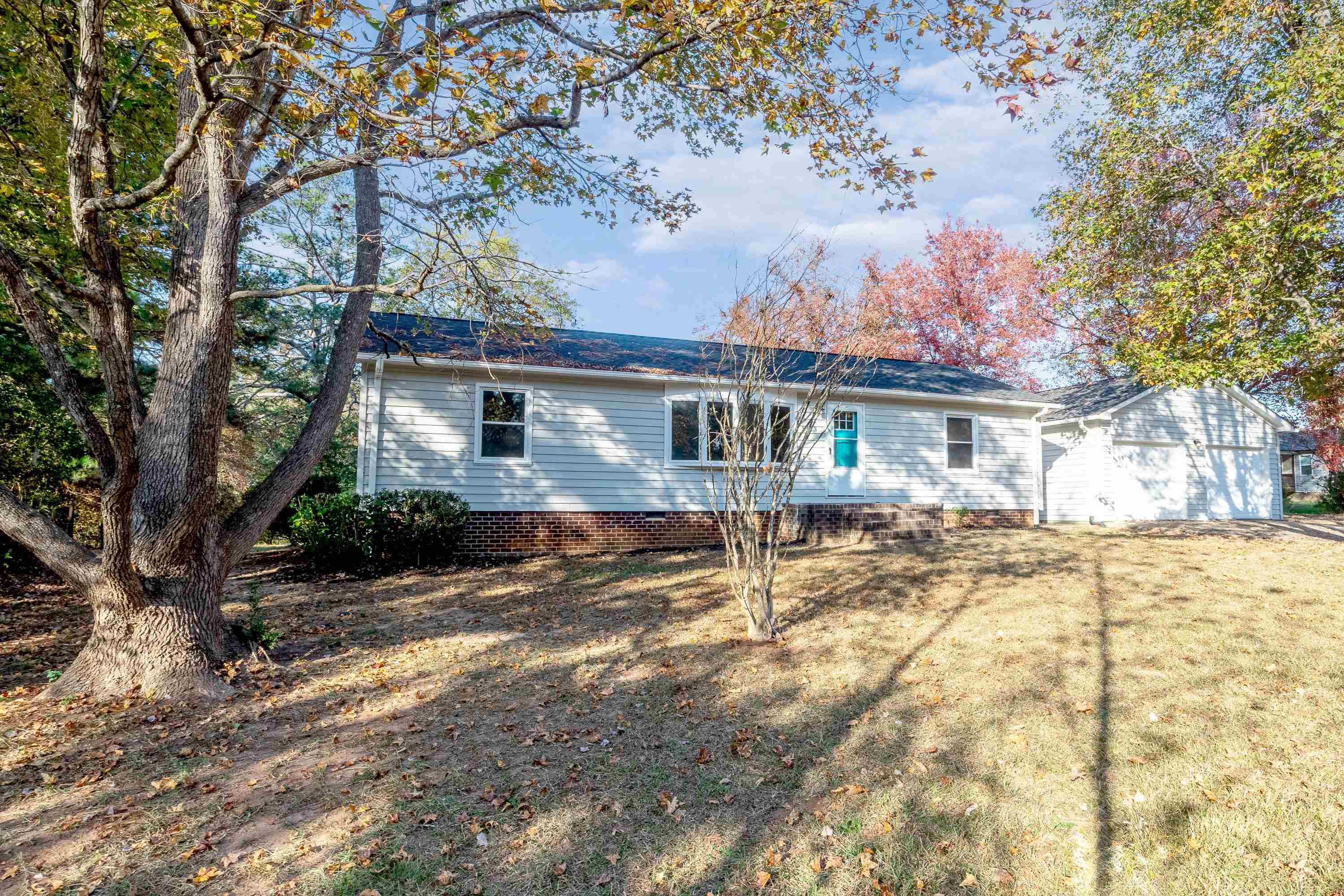 1313 Ewing Drive Garner, NC 27529 - Photo 1 of 46 a view of a house with a yard covered with snow