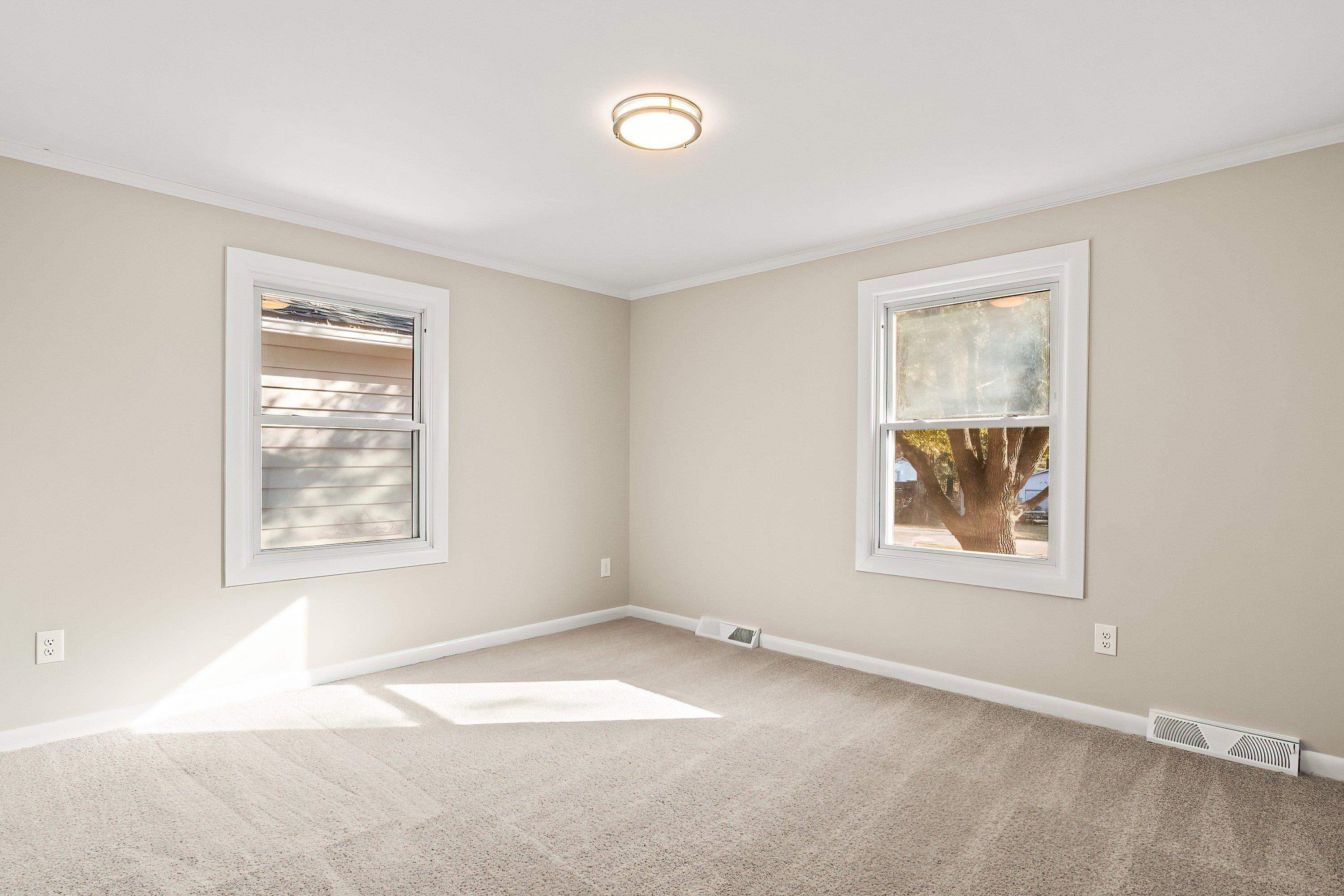 1313 Ewing Drive Garner, NC 27529 - Photo 17 of 46 an empty room with windows