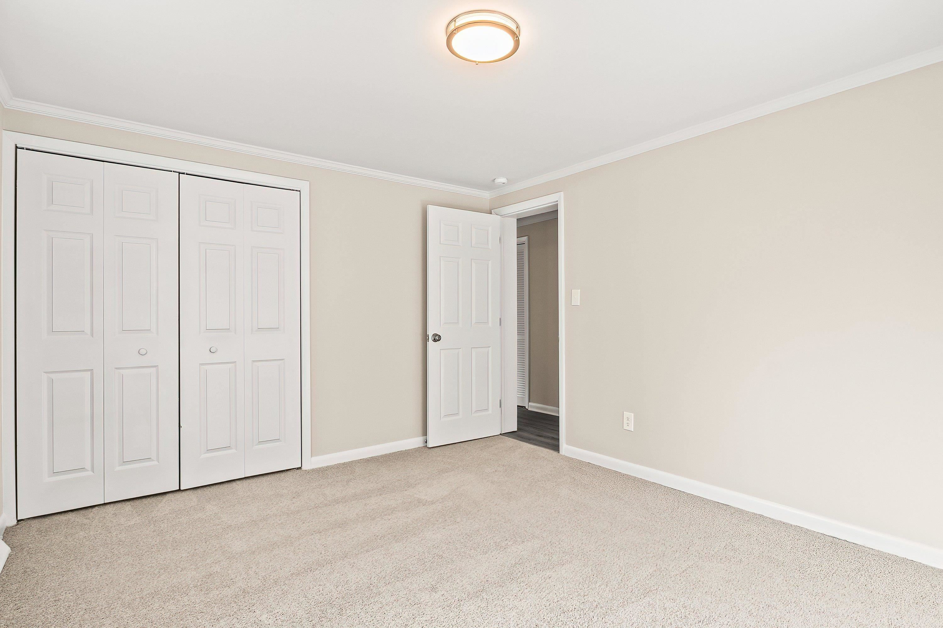 1313 Ewing Drive Garner, NC 27529 - Photo 23 of 46 an empty room with closet area