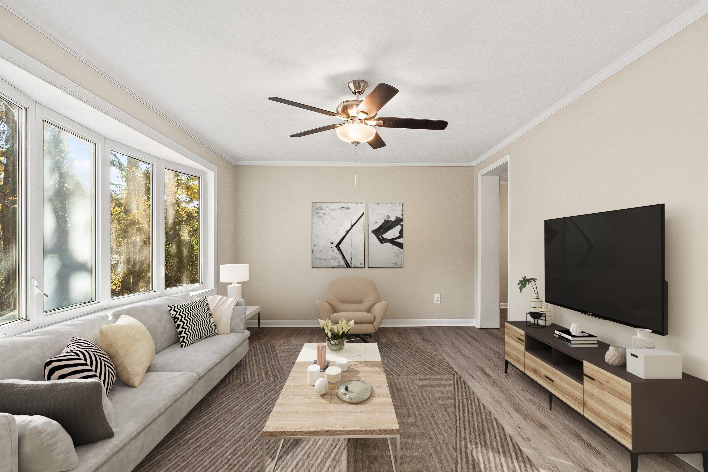 1313 Ewing Drive Garner, NC 27529 - Photo 3 of 46 a living room with furniture and a flat screen tv