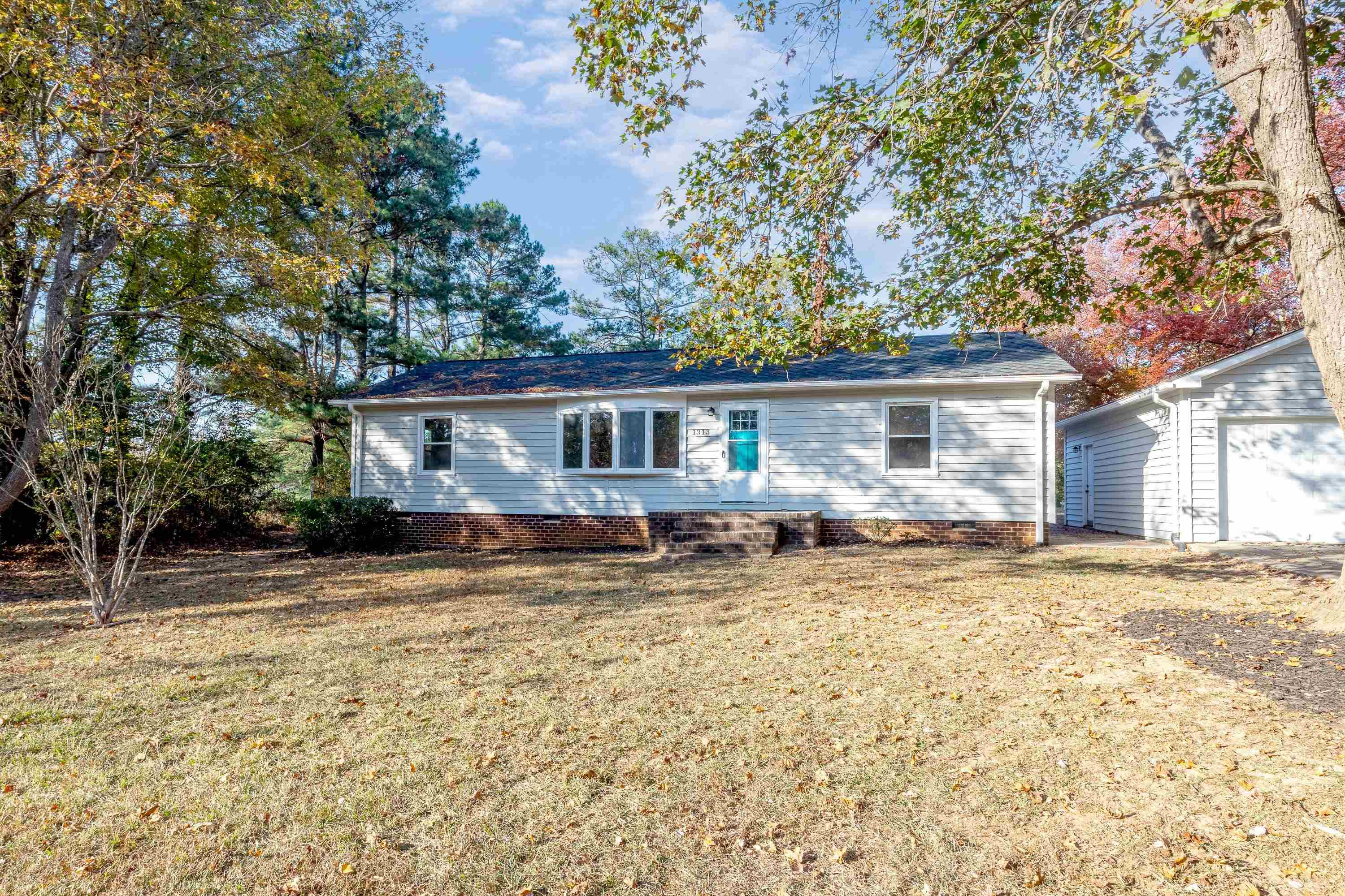 1313 Ewing Drive Garner, NC 27529 - Photo 35 of 46 a view of a house with a patio