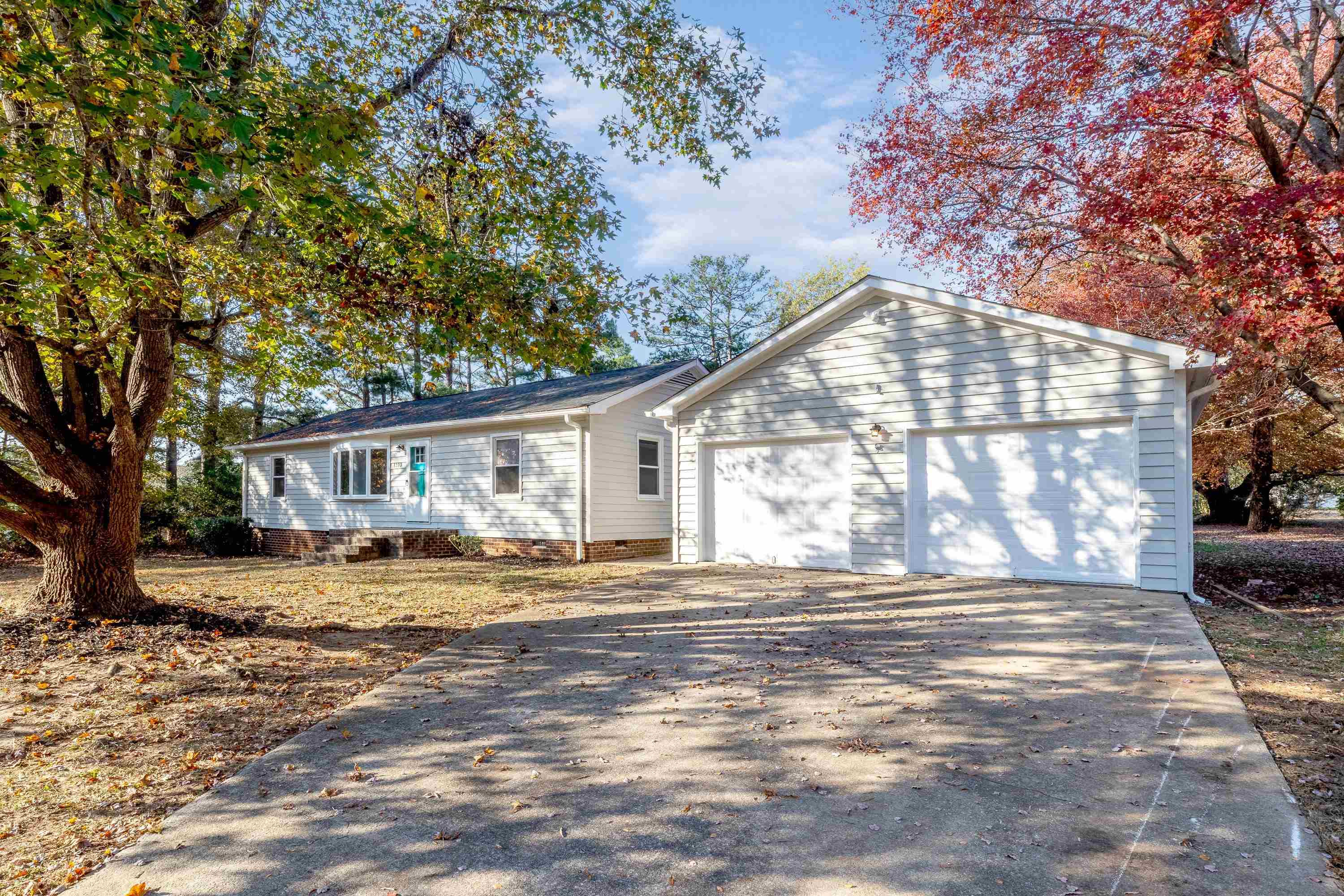 1313 Ewing Drive Garner, NC 27529 - Photo 36 of 46 a view of a house with a yard and sitting area