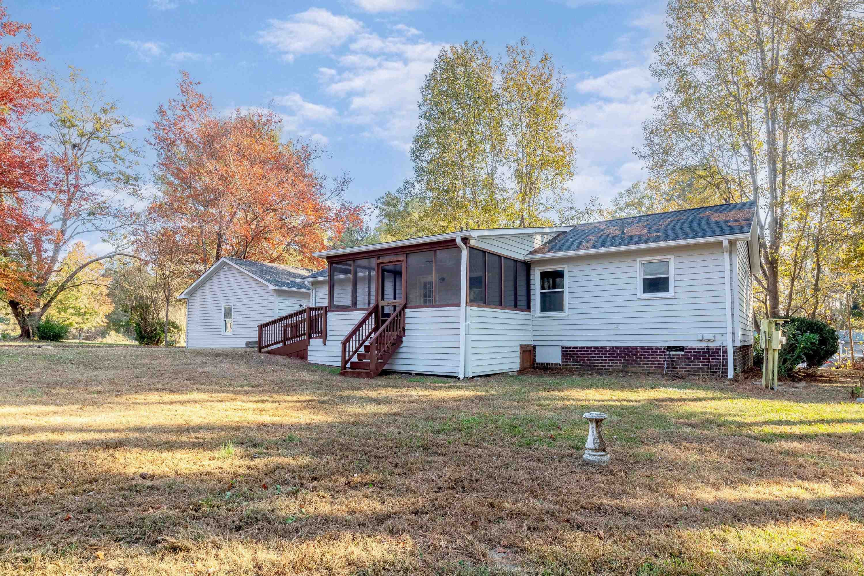 1313 Ewing Drive Garner, NC 27529 - Photo 40 of 46 a view of a house with a yard and sitting area