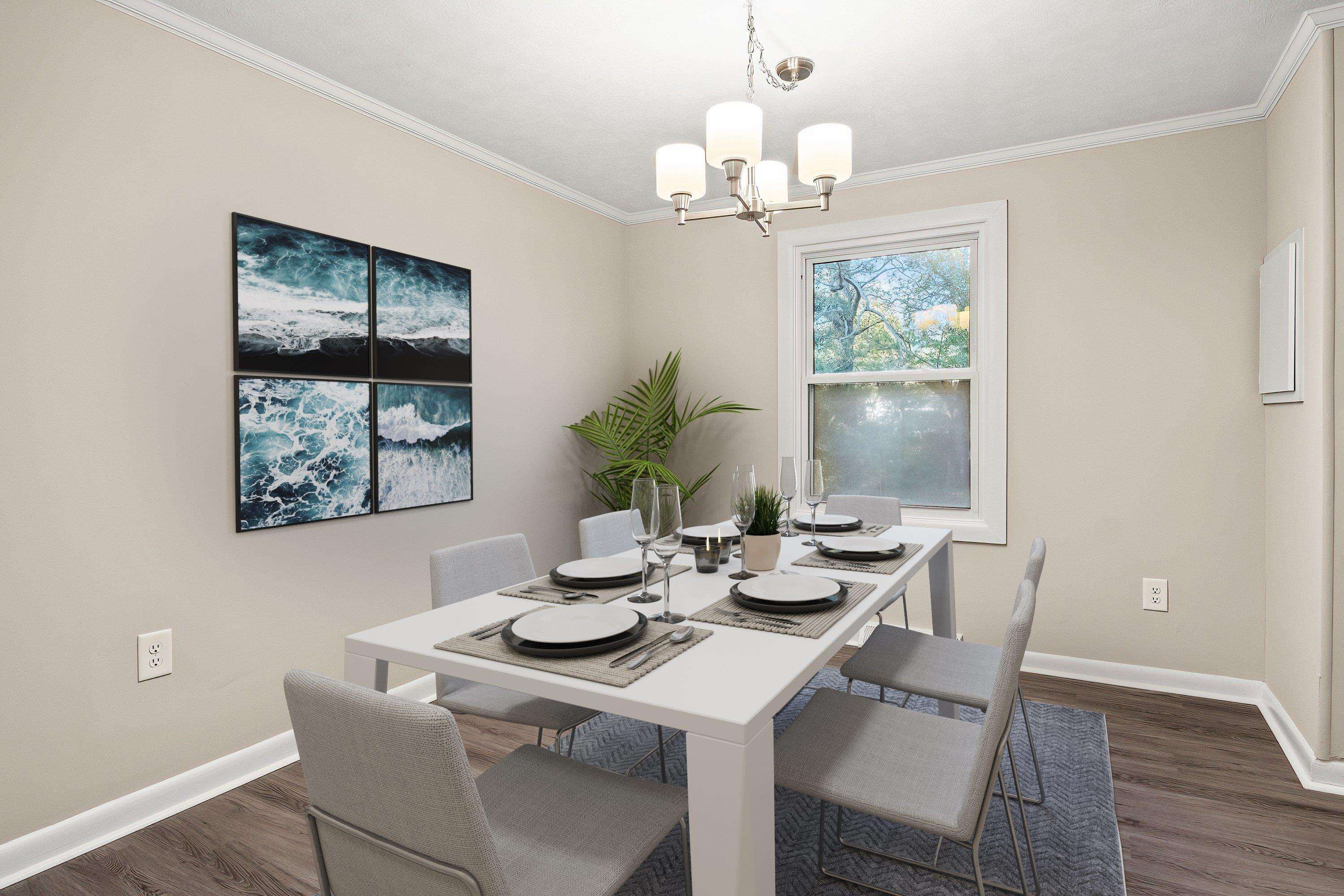 1313 Ewing Drive Garner, NC 27529 - Photo 4 of 46 a view of a dining room with furniture wooden floor and chandelier