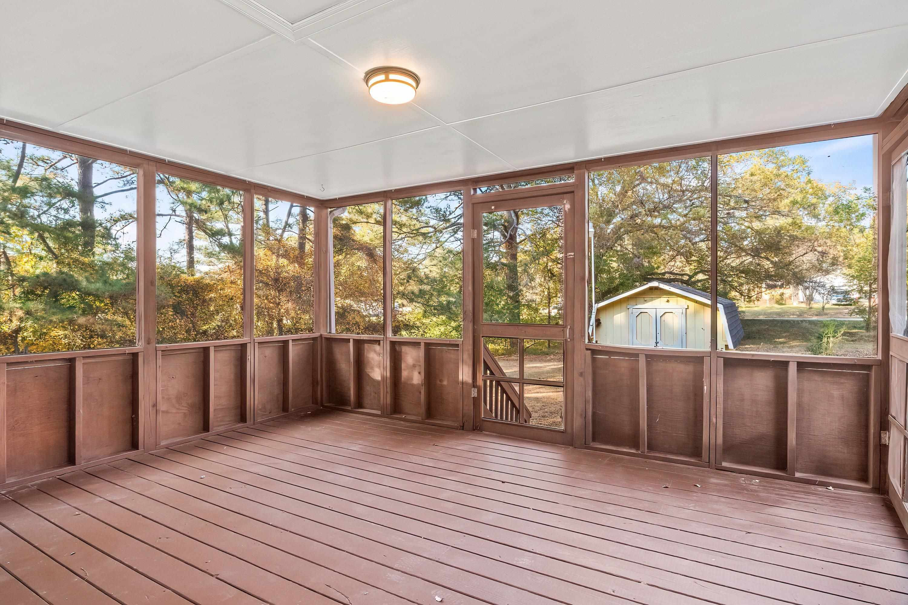 1313 Ewing Drive Garner, NC 27529 - Photo 44 of 46 a view of a room with wooden floor and city view