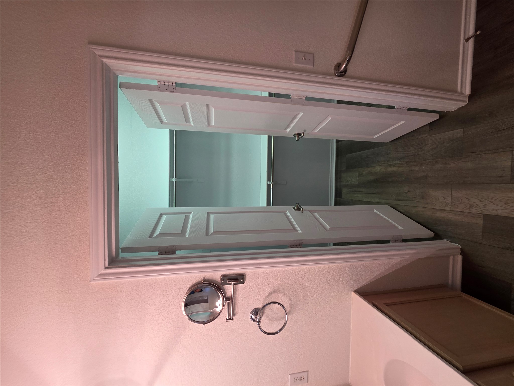 201 Yosemite Road Georgetown, TX 78633 - Photo 13 of 21 Bathroom featuring a textured wall, vanity, dark wood finished floors, and a walk in closet