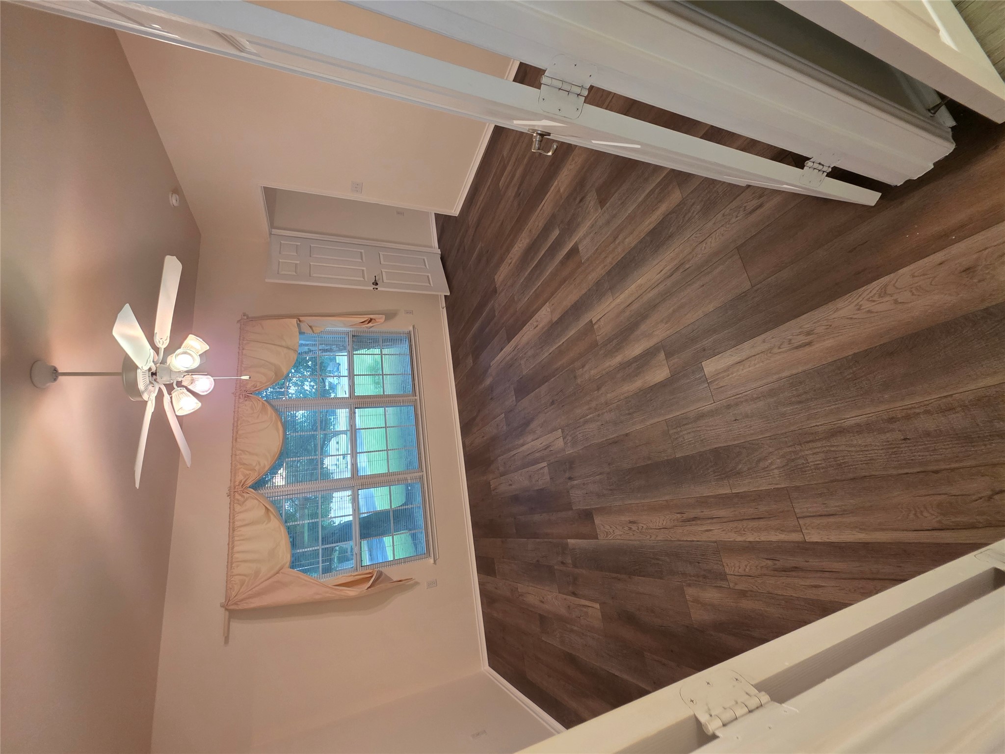 201 Yosemite Road Georgetown, TX 78633 - Photo 15 of 21 Unfurnished room with dark wood-style flooring and ceiling fan